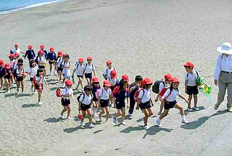 Japanese school children beach field trip