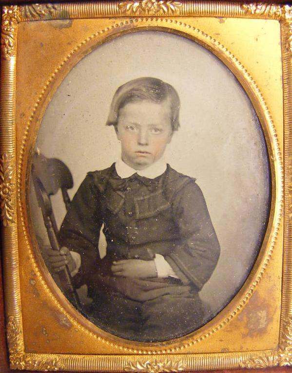 Hohnnie Haley>
<hr>
<i>Figure 1.-- The dealer here could not determine the format of this cased portrait. It looks rather like a color tinted ambrotype to us. The portrait shoes a boy about 6 years old. It is enclosed in a small leather bound 2.5