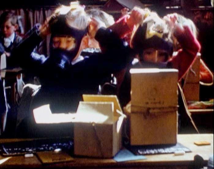 British World War II gas masks and school children :